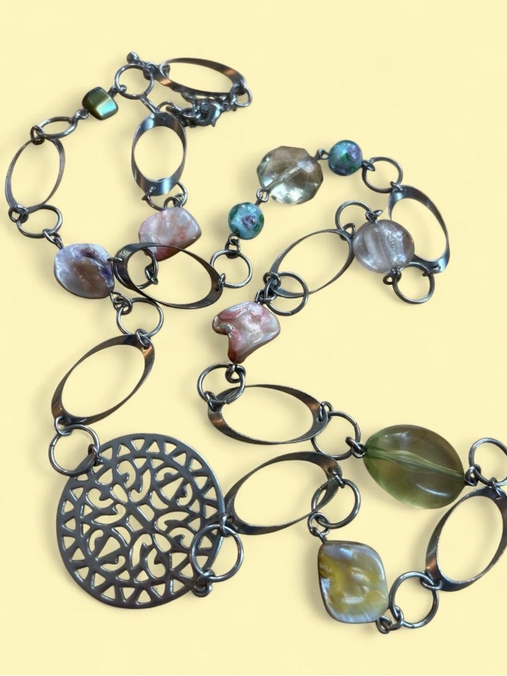 Silver tone pastoral bead shell ring chain necklace with intricate pendant